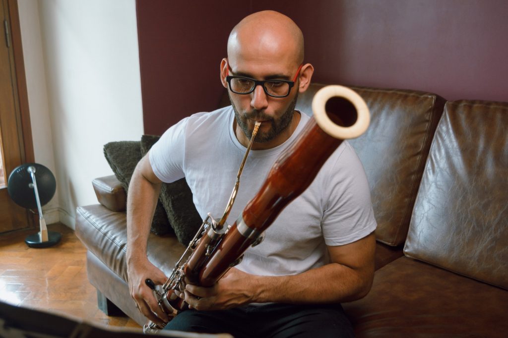 An adult playing bassoon after studying the oboe as a preparatory instrument.